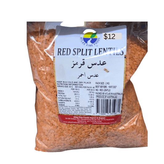 Bag of red split lentils with a label on a white background