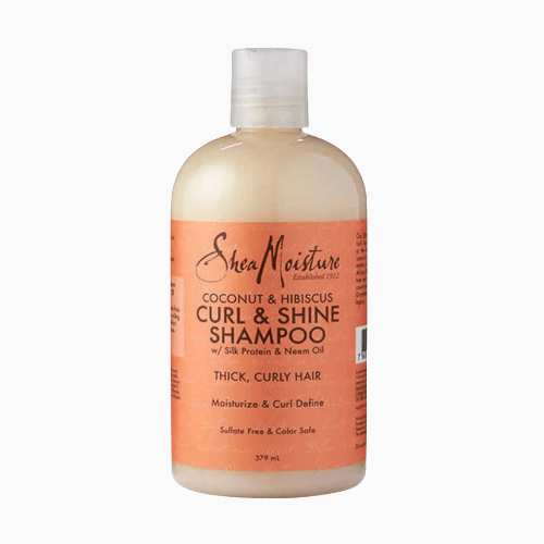 SheaMoisture Coconut & Hibiscus Curl & Shine Shampoo bottle on a white background