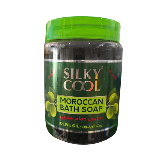 Silky Cool Moroccan Bath Soap in a clear plastic jar with a bright green lid and dark green label featuring olive illustrations.
